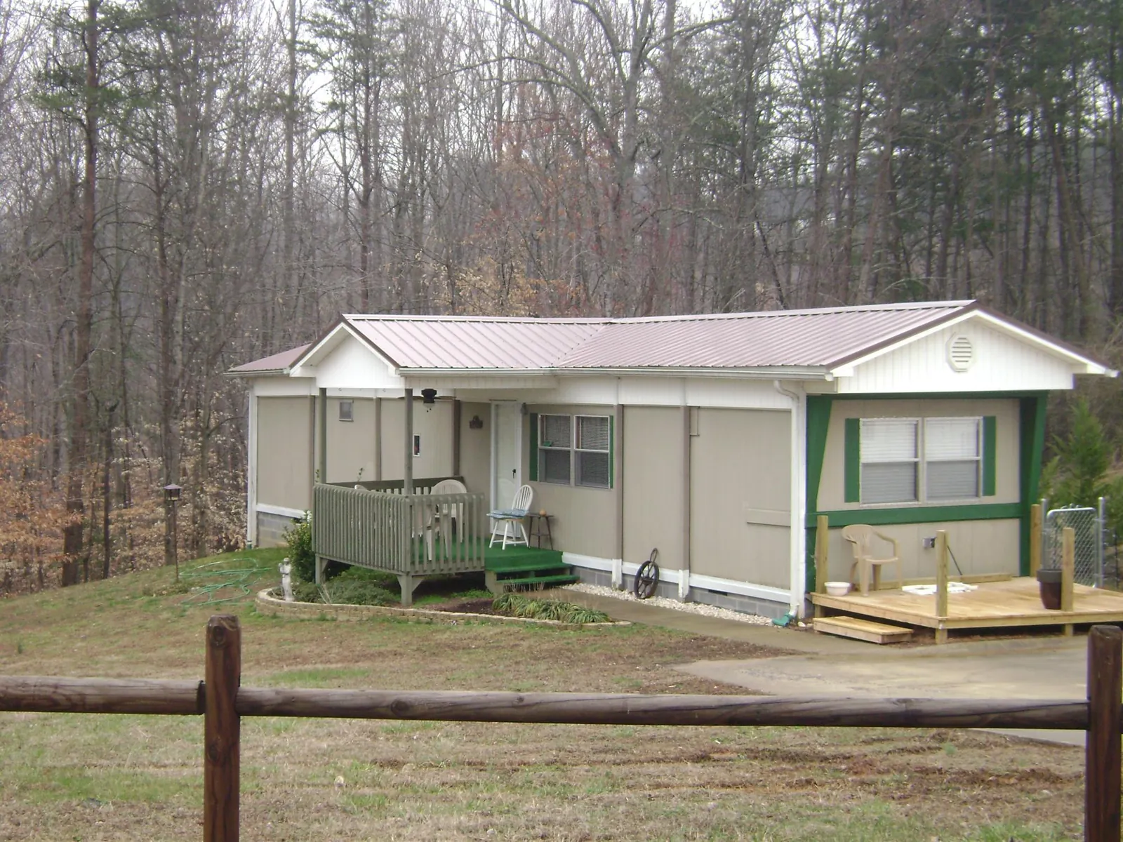 Mauve metal roof on a manufactured home with a new front deck in Butte City